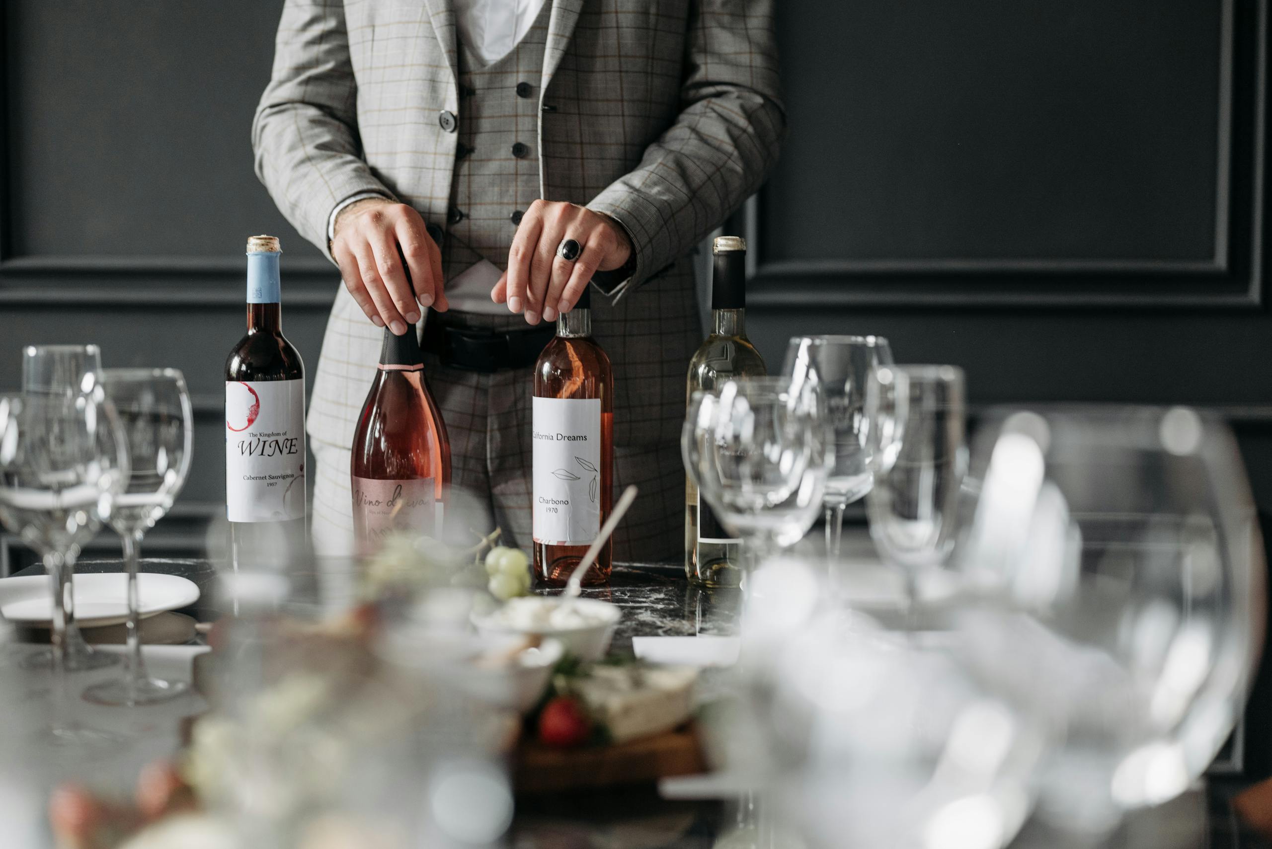 A Person Holding Wine Bottles