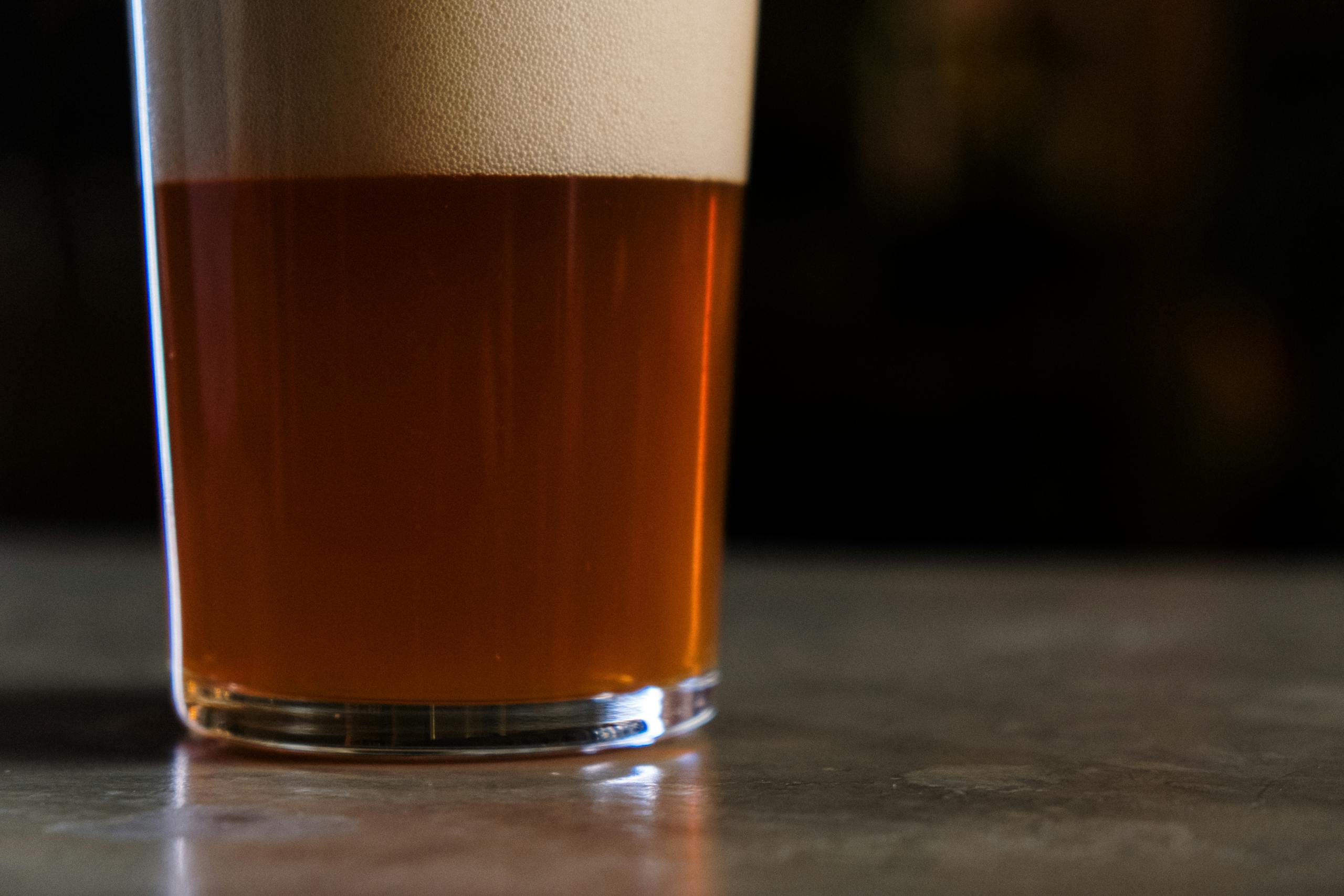 Close Up Shot of Clear Drinking Glass with Beer